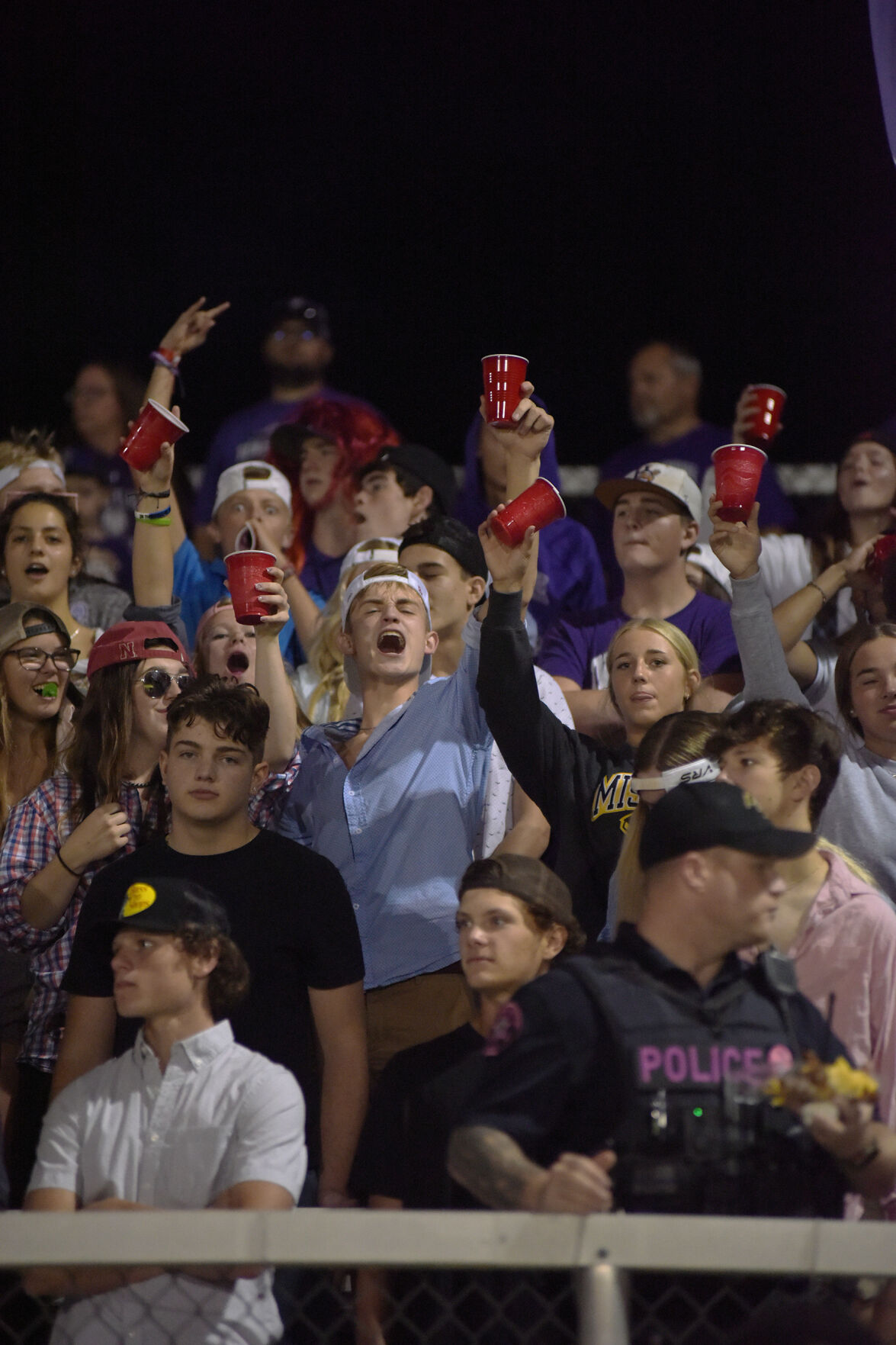 Junior Dawson Wenmeyer raises his cup during Hallsville’s game